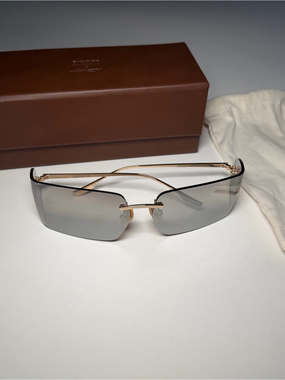Dezi moneybags Rimless Shield Sunglasses - Gray Lenses with Gold Frame